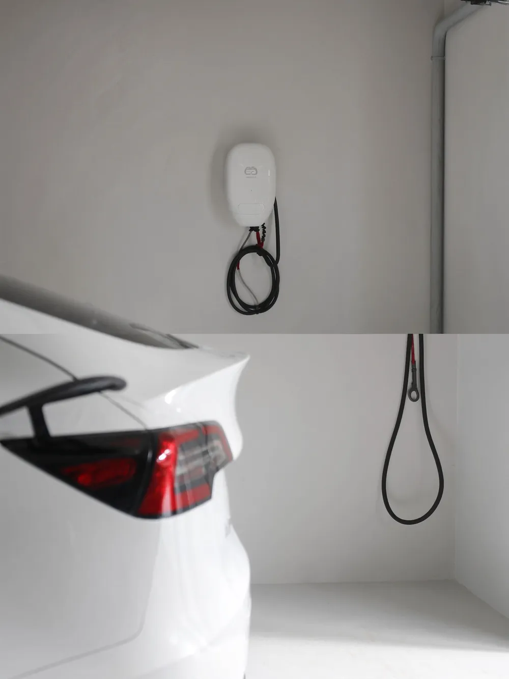 Weiße Wallbox an der Wand einer Garage